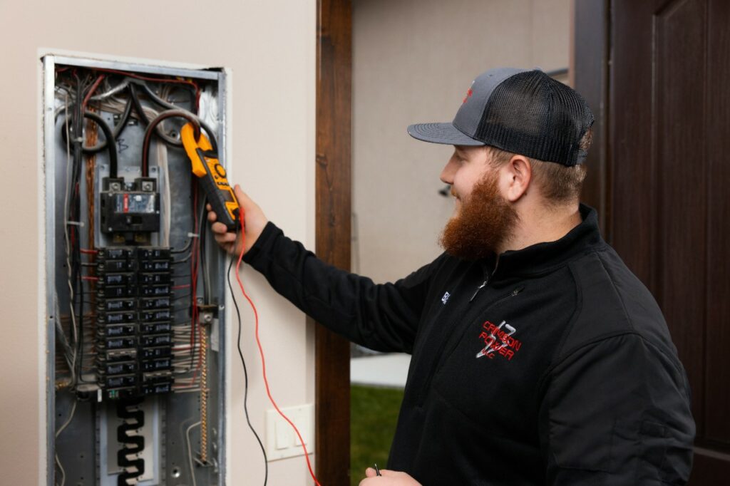 electrician checking breaker from Crimson Power